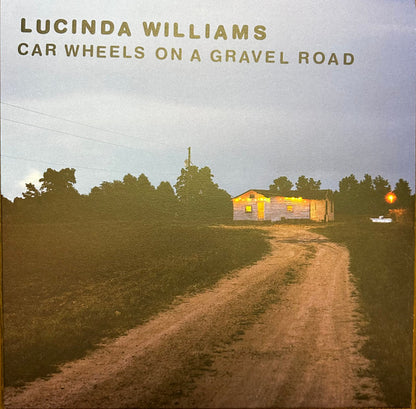 Car Wheels On A Gravel Road - primary